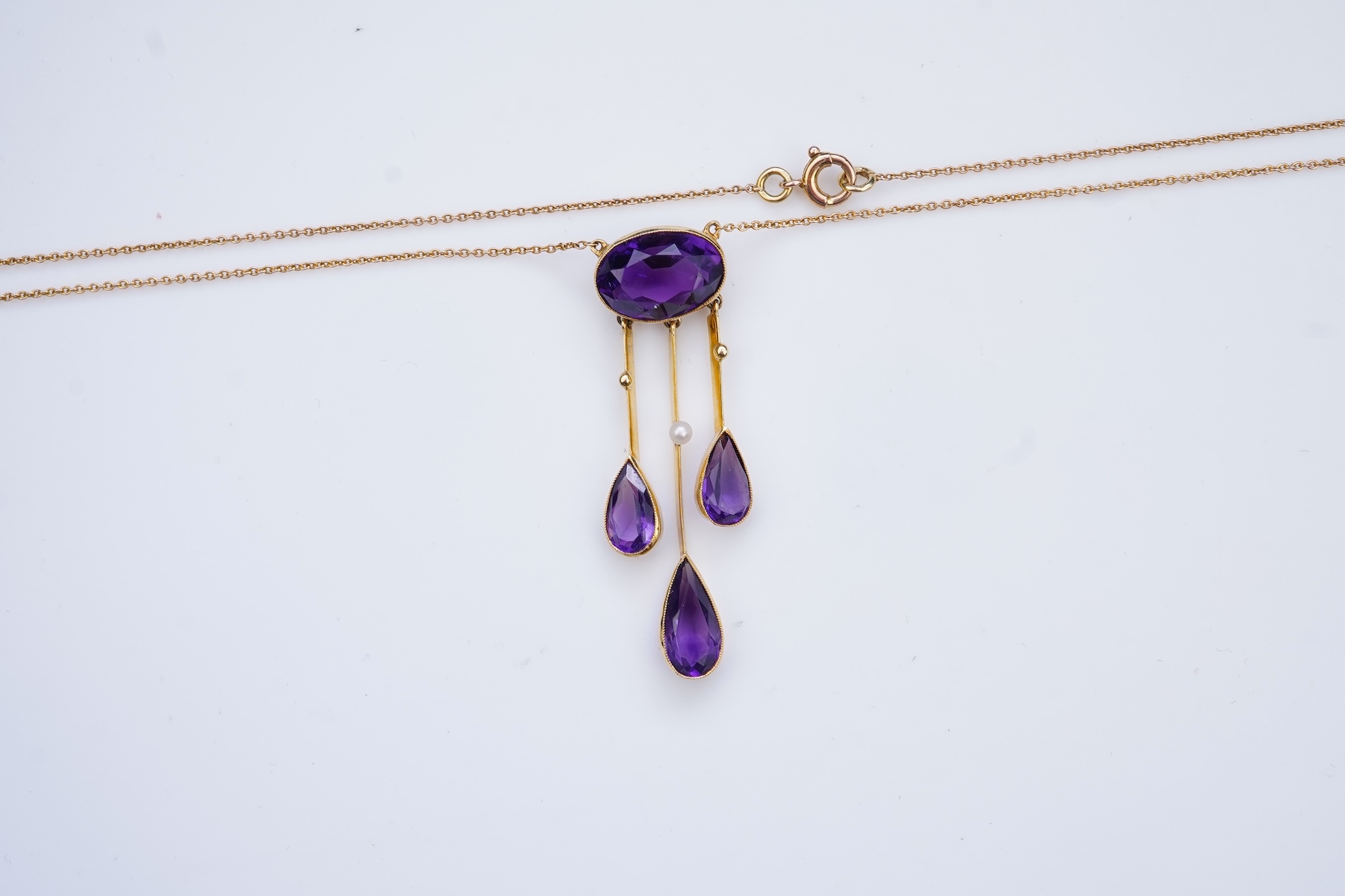 An Edwardian amethyst and seed pearl pendant, circa 1910